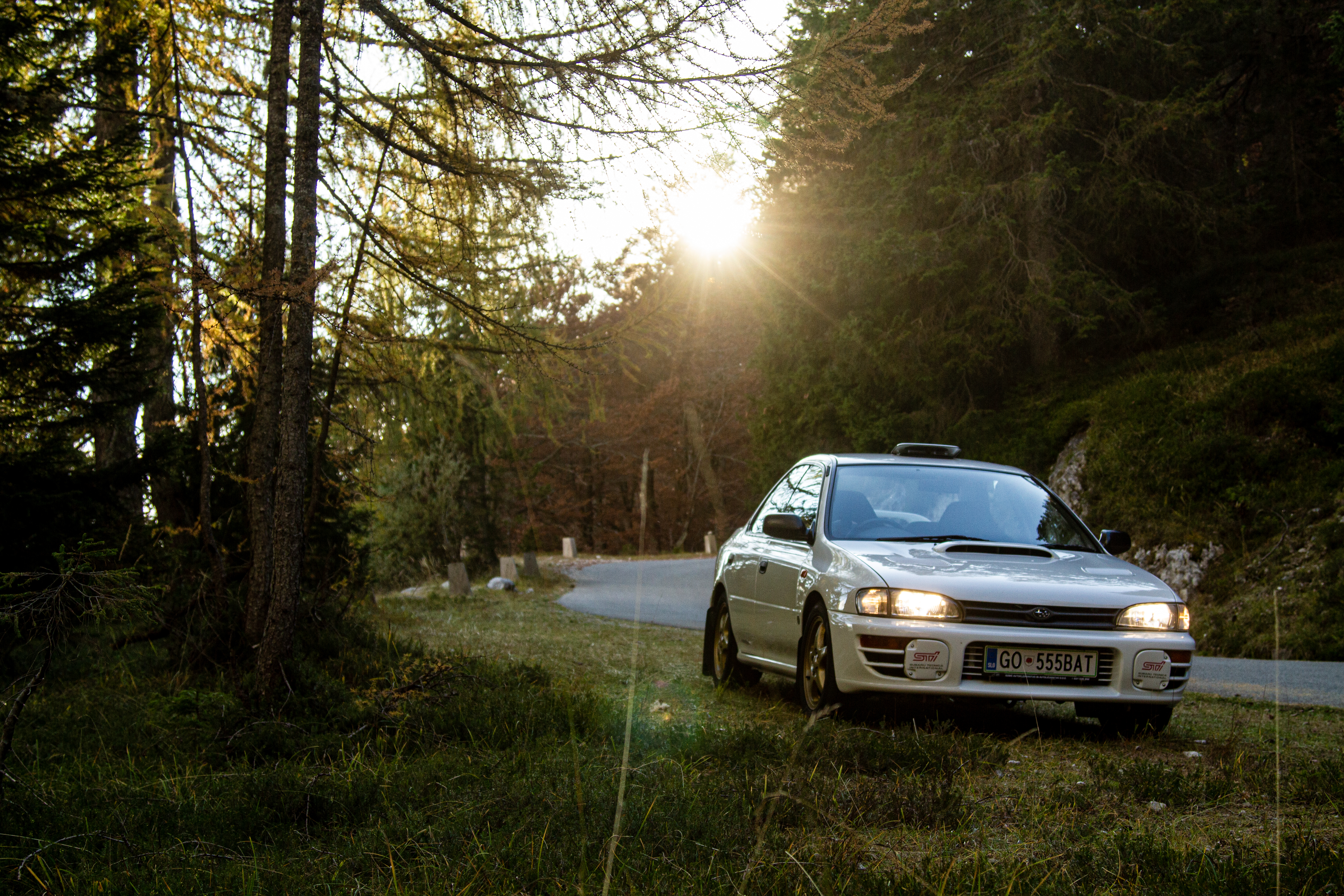 Car Subaru Impreza WRX STI on Slovenian highest mountain road Mangrt road